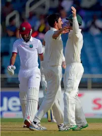  ?? AFP ?? West Indies’ Kraigg Brathwaite walks off after being bowled out by Australia’s Michell Starc on day three of the second Test. —