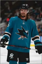  ?? Bay Area News Group/tns ?? San Jose Sharks’ Erik Karlsson smiles while on the ice during their game against the Calgary Flames in the second period at the SAP Center in San Jose on Sept. 27.