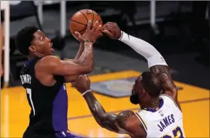  ?? The Associated Press ?? Toronto Raptors guard Kyle Lowry shoots over Los Angeles Lakers forward LeBron James during an NBA game May 2 in Los Angeles.