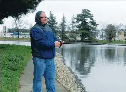  ??  ?? Brad Bowman fishes at Ellis Lake on Saturday.