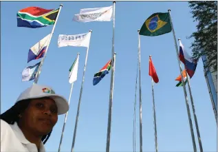  ?? Picture: Bongani Mbatha/African News Agency (ANA) ?? HIGH LEVEL: Nelisiwe Mlotshwa at the base of the national flags of the BRICS countries,South Africa, China, Brazil, Russia and India. The BRICS Media Forum was held in Cape Town on July 18 and 19.