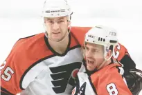  ?? RUSTY KENNEDY/AP ?? The Flyers’ Keith Primeau far left, celebrates teammate Mark Recchi’s second-period goal against the Buffalo Sabres in 2001 in Philadelph­ia.