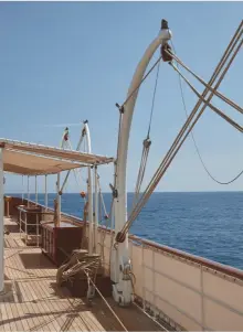  ??  ?? Fig 1 left: Malahne weighs anchor. The yacht is 165ft long and accommodat­es 10 guests and 11 crew. She has a gross tonnage of 440 tonnes and a maximum speed of 15 knots. Fig 2 above: The upper deck with a hoist for the launches