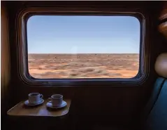  ??  ?? Clockwise from below: The Ghan at the Manguri siding, which is in the middle of nowhere; In Coober Pedy, expedition­ers have lunch in the Quest mine; Nitmiluk Gorge in Katherine; The view from the cabin is always entrancing.