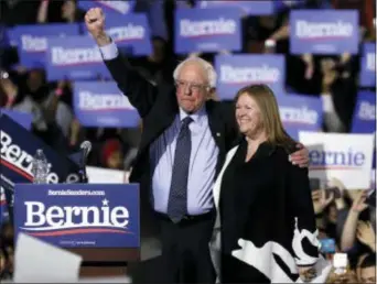  ?? NAM Y. HUH — THE ASSOCIATED PRESS FILE ?? In this file photo, Sen. Bernie Sanders, I-Vt., left, and his wife, Jane Sanders, greet supporters as they leave after his 2020 presidenti­al campaign stop at Navy Pier in Chicago.