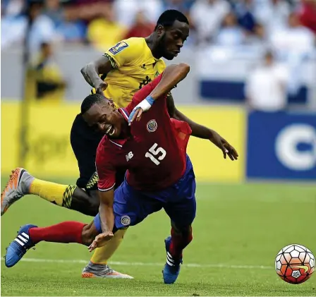  ?? — reuters ?? Hard knock: Costa rica’s Junior Diaz falls as he battles for the ball with Jamaica’s Je-Vaughn Watson during their Gold Cup Group B match at the Stub Hub Centre in los Angeles on Wednesday. The teams drew 2-2.