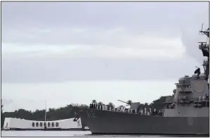  ?? AP/AUDREY McAVOY ?? The USS Michael Murphy passes by the USS Arizona Memorial in Pearl Harbor during a ceremony Friday marking the 77th anniversar­y of the Japanese attack in 1941.