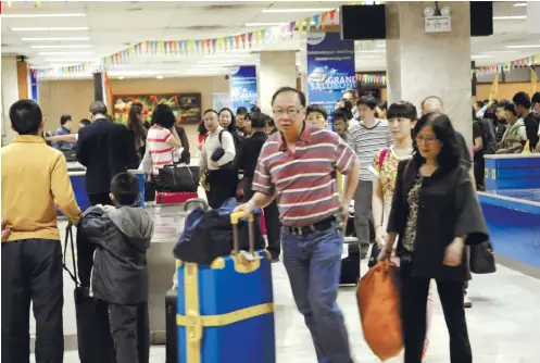  ?? SUNSTAR FILE ?? A FRIENDLY INVASION? The number of Chinese tourists and workers in Central Visayas, particular­ly Cebu, has ballooned following President Rodrigo Duterte’s three visits to the People’s Republic of China since he took office in 2016.