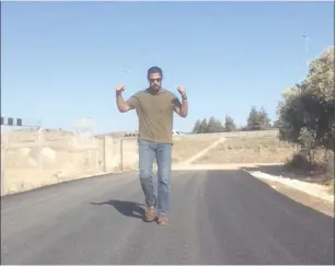  ?? (Courtesy) ?? ISRAELI DIPLOMAT Ishmael Khaldi walks along the access road to the Bedouin village of Khawaled.