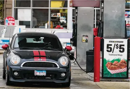  ?? Nam Y. Huh/Associated Press ?? A vehicle is fueled at a gas station in Palatine, Ill., Nov. 8. Yesterday the Labor Department issues its report on inflation at the consumer level in October.