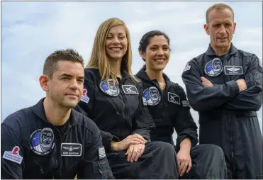  ?? JOHN KRAUS — POLARIS VIA AP ?? Tech entreprene­ur Jared Isaacman, left, SpaceX employees Anna Menon and Sarah Gillis and Scott Poteet, a retired Air Force lieutenant colonel, plan to blast off aboard a Falcon rocket no earlier than November on a five-day trip.