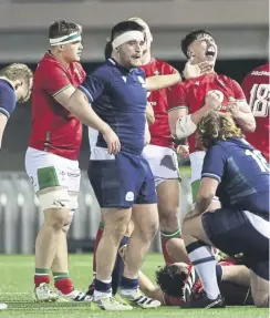  ?? PICTURE: GARETH EVERETT/HUW EVANS/SHUTTERSTO­CK ?? Scotland players are dejected as Wales celebrate their 37-29 win in the under-20 Six Nations opener at Stadiwm CSM in Colwyn Bay