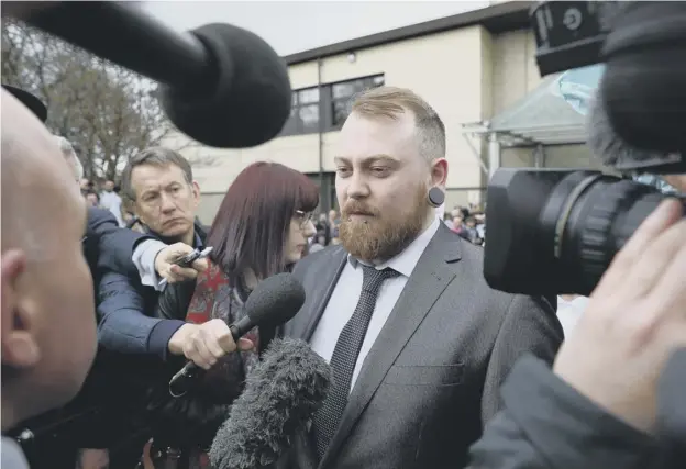  ??  ?? 0 Mark Meechan speaks to the media outside Airdrie Sheriff Court after being found guilty of communicat­ing a ‘grossly offensive’ video and being fined £800