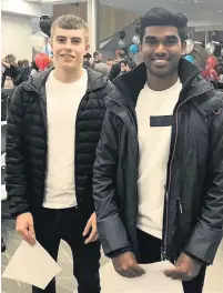  ??  ?? ●●Joe Robinson and Nitin Babu at Rochdale Sixth Form College