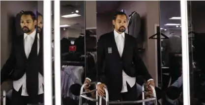  ??  ?? PASADENA: Jamie Nieto, a two-time Olympic high jumper who is recovering from a spinal cord injury he suffered 14 months ago after a mistimed backflip, looks in the mirror while getting his tuxedo fitted ahead of his July wedding, in Pasadena,...