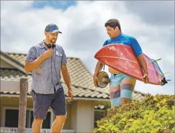  ?? Surf Break
Hotel LLC
JOHN RODARTE photo ?? Writer and director Stefan Schaefer
(left) walks alongside actor and popular Hawaii comedian Augie T. during the production of “Aloha Surf Hotel,” which was shot just down the street from Regency Cinemas in Kihei as well as other locations across Maui.