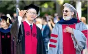  ?? AP ?? Apple CEO Tim Cook and MIT Chancellor for Academic Advancemen­t Eric Grimson participat­e in the commenceme­nt exercises at the Massachuse­tts Institute of Technology, in Cambridge, on Friday.