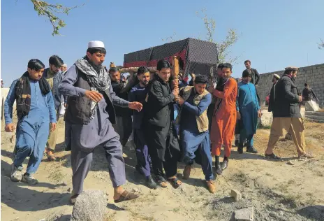  ?? Reuters ?? Men carry the coffin of one of three female media workers shot dead only minutes after leaving work at a television station