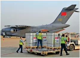  ?? Photo: AFP ?? Sinopharm vaccines arrive at Phnom Penh on February 7.