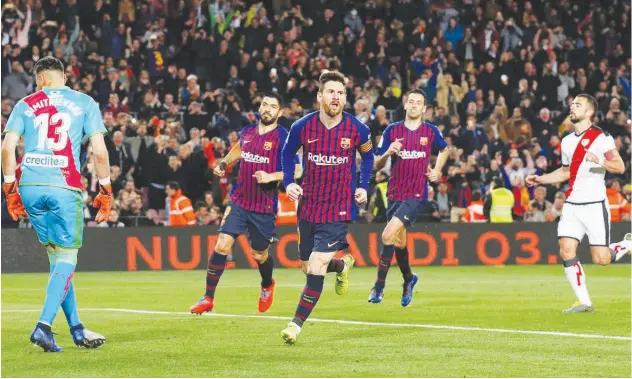  ?? Reuters ?? Barcelona’s Lionel Messi celebrates after scoring a goal against Rayo during their Spanish League match.