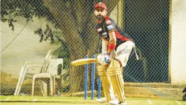  ?? Courtesy: RCB Twitter ?? ↑
Royal Challenger­s Bangalore’s captain Virat Kohli bats during a practice session ahead of their IPL match against Rajasthan Royals.