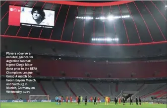  ?? (AFP) ?? Players observe a minutes’ silence for Argentine football legend Diego Maradona prior to the UEFA Champions League Group A match between Bayern Munich and Salzburg in Munich, Germany, on Wednesday.