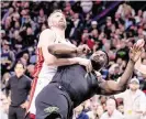  ?? STEPHEN LEW USA TODAY NETWORK ?? Heat forward Kevin Love fouls Pelicans forward Zion Williamson in the fourth quarter, which started a melee.