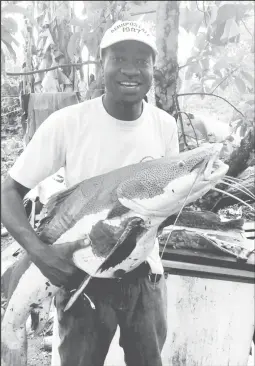  ?? ?? Quado Vancooten poses with a freshwater catfish