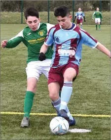  ??  ?? Drogheda’s Altay Guneyer holds off Eoghan Doherty (Donegal).