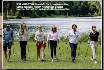  ?? ?? WALKING TOUR From left, Christian Neureuther, Carrie Johnson, Miriam Neureuther, Brigitte Macron, Britta Ernst and Amelie Derbaudren­ghien