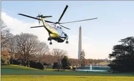  ?? Evan Vucci Associated Press ?? MARINE ONE lif ts off at the White House, taking President Trump to Florida as Congress copes with his rejection of crucial defense and COVID- 19 relief bills.
