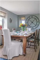  ??  ?? dining area ‘This is our favourite place to entertain as it’s convenient­ly situated next to the kitchen and overlooks the pretty valley,’ says Laetitia. take a look at the rustic oversized iron skeleton clock, £135, the Farthing. Nailsea large wine...