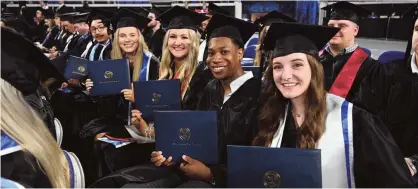  ?? ?? Class of 2022 graduates are all smiles after receiving their degrees during spring commenceme­nt ceremonies held May 7 at Murphy Center.