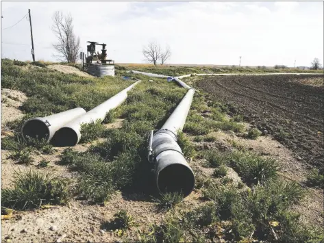  ?? BRITTANY PETERSON/AP ?? WATER PIPES LIE DORMANT ON DON SCHNEIDER’S PROPERTY on April 29 in Ovid, Colo. He pumps water from a shallow aquifer for irrigation, and uses supply from the South Platte River to replenish the wells.