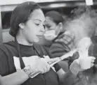  ?? COMMERCIAL APPEAL JOE RONDONE/THE ?? Crystal Anglin pours out gravy and grits for patrons at Bryant’s Breakfast on Summer Avenue during a soft opening on Tuesday.