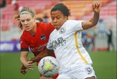  ?? Associated Press ?? Veronica Latsko, of Peters Township and the Houston Dash, contests Utah’s Elizabeth Ball for the ball last month in an NWSL Challenge Cup match.