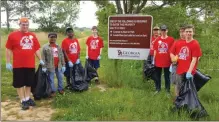  ?? / Contribute­d ?? Local scouts took part in helping clean up around the lake at the J.L. Lester Wildlife Management Area during the Great American Cleanup on Saturday, May 5, 2018.