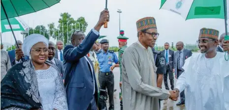  ?? Photo: State House ?? FCT Minister, Malam Muhammad Musa Bello (right), see off President Muhammadu Buhari and his wife Aisha Muhammadu Buhari, before their departure from Abuja to New York ahead of the 73rd Session of the UN General Assembly yesterday.