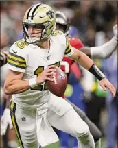  ?? Sean Gardner / Getty Images ?? The Saints’ Trevor Siemian replaced an injured Jameis Winston and led New Orleans to a 36-27 win over Tampa Bay. He finished 16 of 29 for 159 yards and a TD.