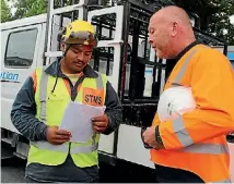  ?? PHOTO: MIKE BAIN ?? Receiving a safety briefing from Sargent Puaha is Evolution Road Services manager Don O’Sullivan.