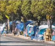  ??  ?? DOZENS of veterans live at an encampment outside the West Los Angeles VA campus. Homelessne­ss is the top issue for voters in the 2022 mayor’s race.