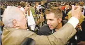  ?? File / The Associated Press ?? New Orleans coach Sean Payton hugs Saints’ owner Tom Benson on Sept. 25, 2006. The Falcons will play the Saints tonight on the 10th anniversar­y of the Superdome’s reopening.