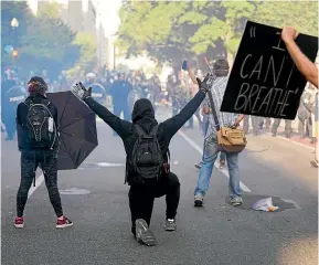  ?? AP ?? Protesters confront police in Washington over the death of George Floyd. The political system has failed to tackle racism and inequality for decades.