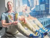  ?? Bebeto Matthews/Associated Press ?? Baseball player Alex Katz shows off his custom cleats on March 1 in New York.