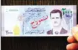  ?? SANA AFP AFP PHOTO/HO/ ?? Syria’s newly announced 2,000 Syrian pound note.