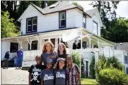  ?? THOMAS BOYD — THE OREGONIAN VIA AP ?? This June 2014 photo shows Devonte Hart with his family at the annual celebratio­n of “The Goonies” movie in Astoria, Ore.