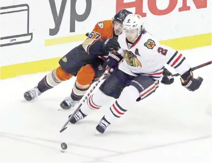  ??  ?? ANAHEIM: Anaheim Ducks center Rickard Rakell (67) and Chicago Blackhawks defenseman Duncan Keith (2) chase the puck in the second period of an NHL hockey game in Anaheim, Calif., Friday. — AP