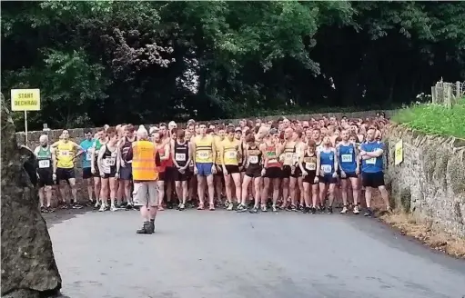  ??  ?? Competitor­s under starter’s orders at the Merthyr Mawr Lane 5k event