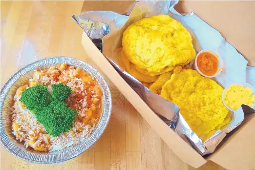  ?? RICHARD S. DARGAN/FOR THE JOURNAL ?? Green Gene Vegan Café’s macaroni and cheese, left, and Trinidad Doubles, rounds of fried dough sandwiched around curried chickpeas.