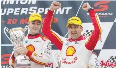  ?? Picture: AAP IMAGE ?? Fabian Coulthard (right) celebrates on the podium watched by teammate Scott McLaughlin.